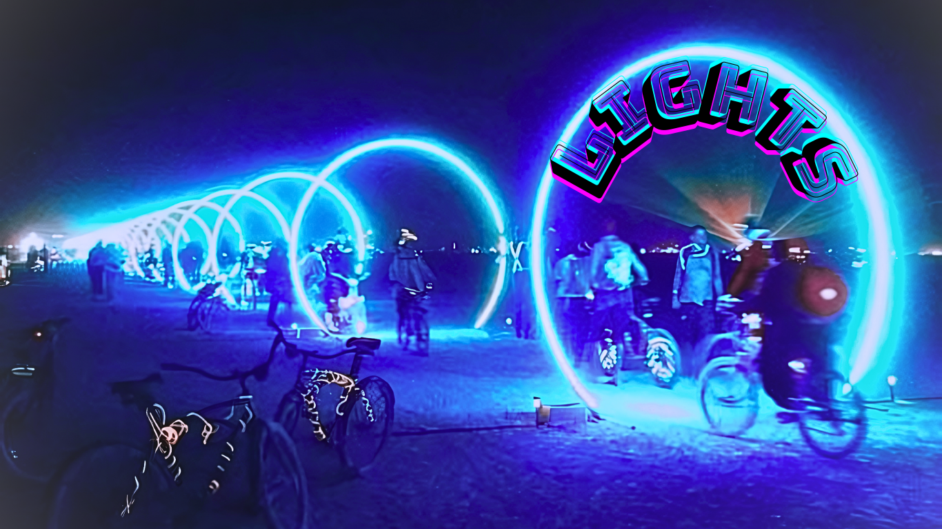 Glowing blue LED light rings arching over bikes on the playa at night, text overlay reads Lights